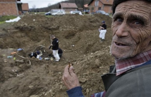 Bosnian Muslim man Smajil Hukic, 80, who lost his relatives looks on in front of mass grave in attempt to identify his relatives in a mass grave in the village of Cerska near Srebrenica (formerly in nearby municipality of Vlasenica, now in the Serb municipality of Milici)