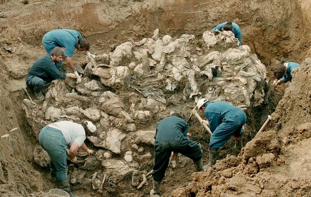Bosnian Genocide (1995), Forensic experts of the International war crimes tribunal inspect remains of the Srebrenica massacre victims in the Pilica mass grave on 24 July 1995.